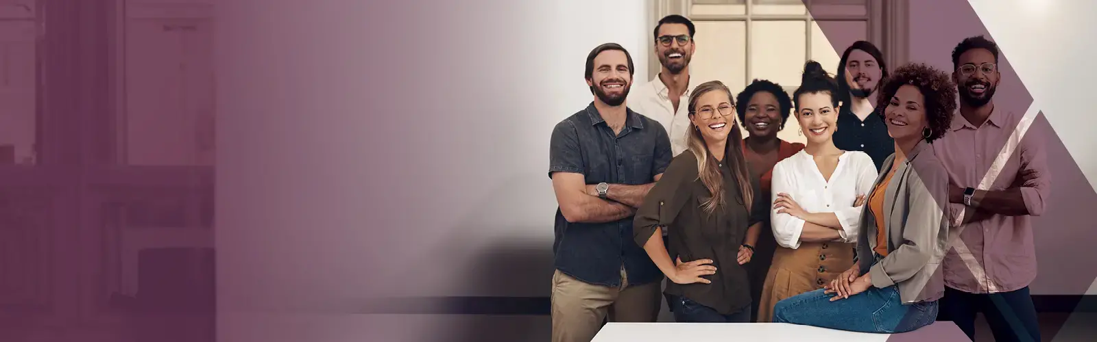 Group of professionals smiling at the camera. 