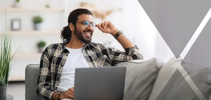 Happy student working using laptop 