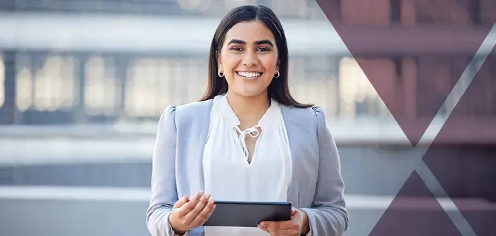 Confident person holding tablet and smiling at the camera