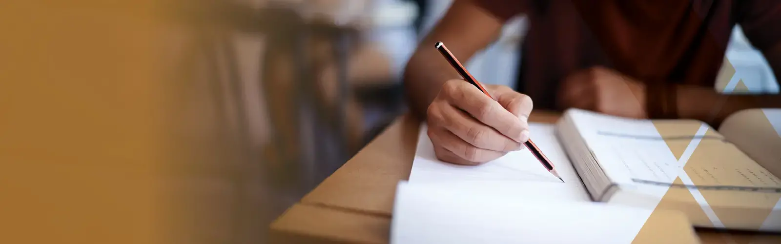 Hand holding a pencil to paper 