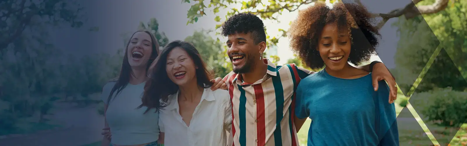 Happy multiethnic people walk embracing on summer day outdoors 