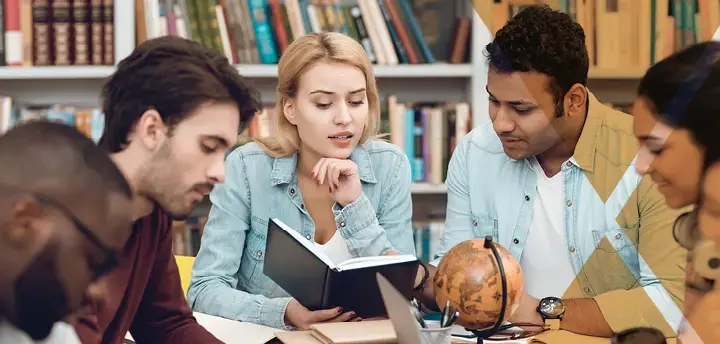 Group of ethnic multicultural students in library 