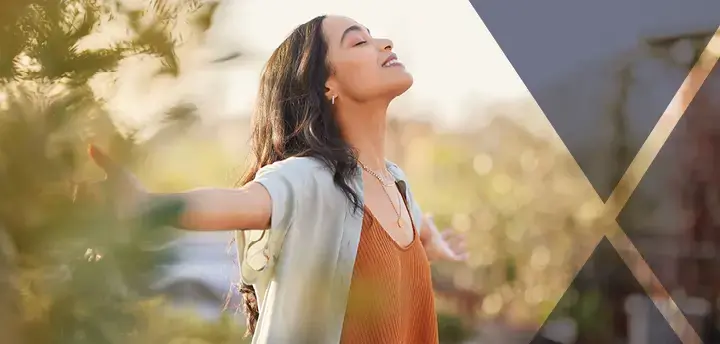 Young adult enjoying sunset with gratitude 
