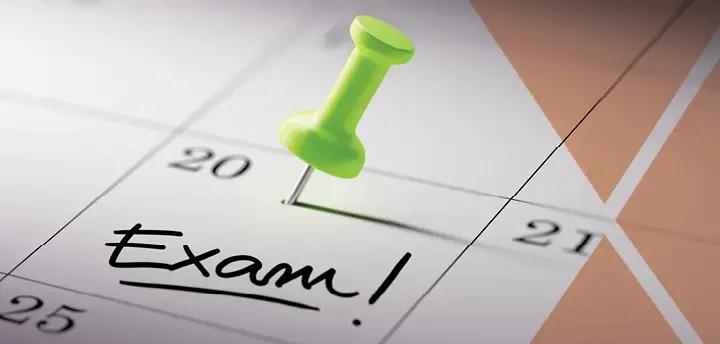 Calendar with a pinpoint and the word ‘Exam!’ 