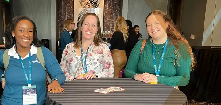 Group of professionals standing at a table at a Conference  