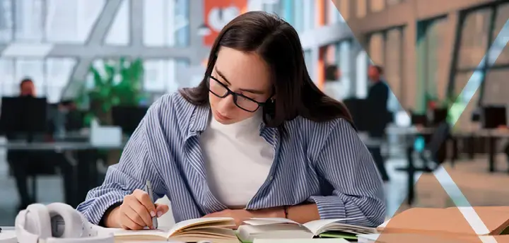 Woman with glasses studying.